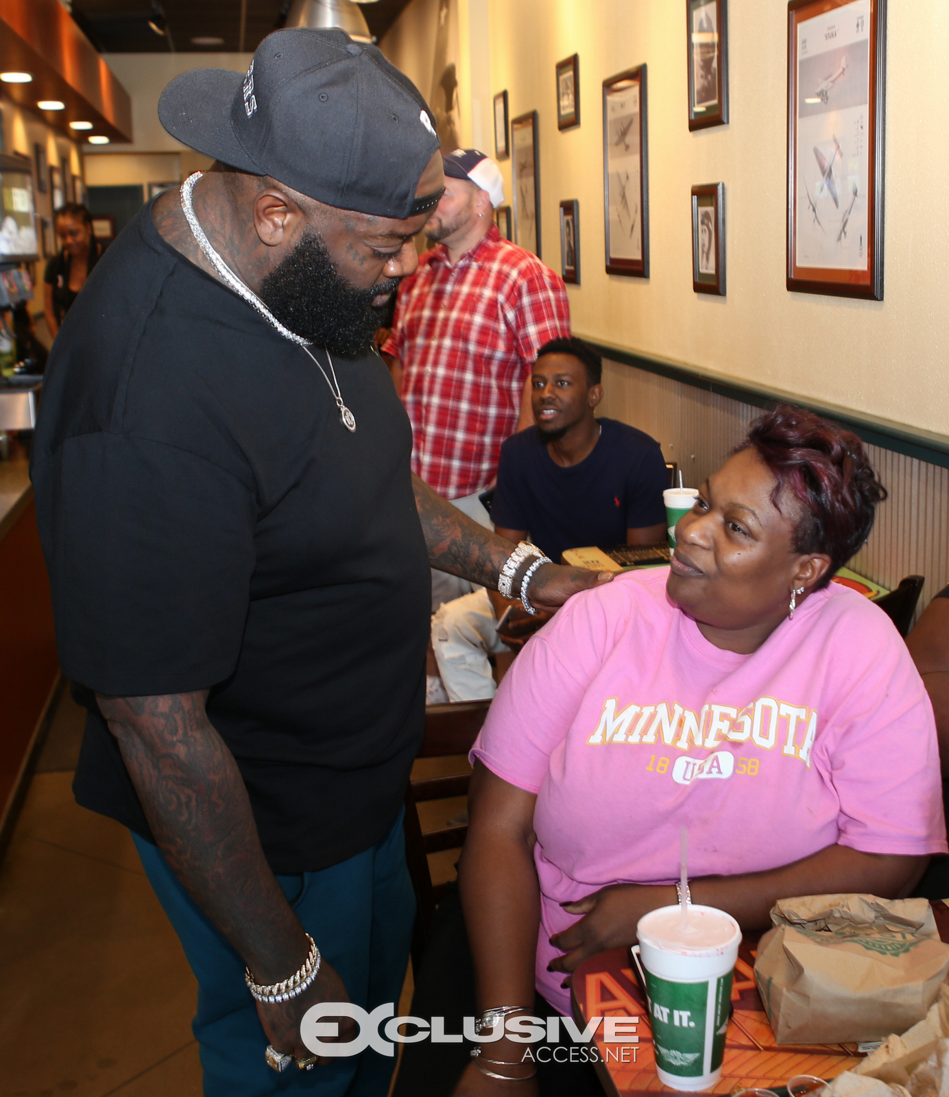 Rick Ross stops by his wingstop in Newnan