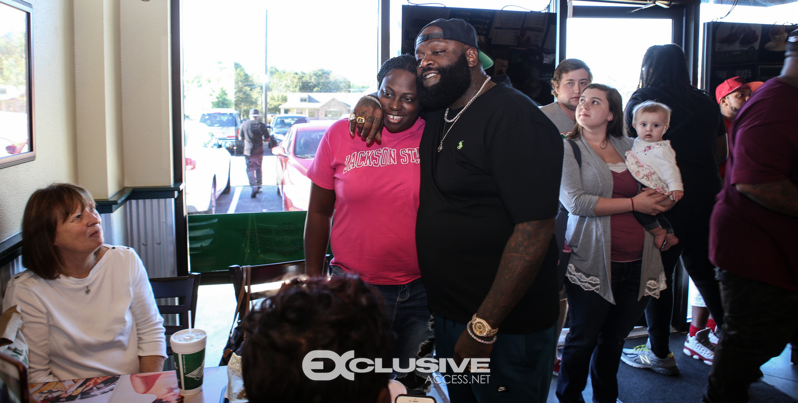 Rick Ross stops by his wingstop in Newnan