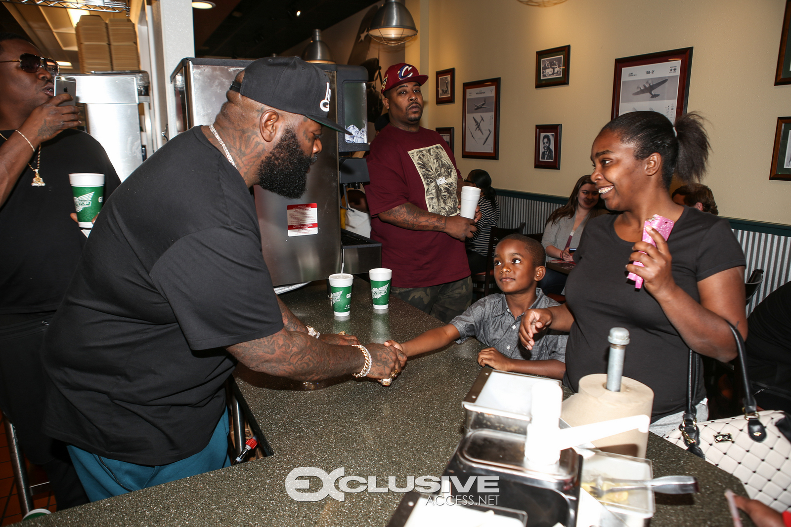 Rick Ross stops by his wingstop in Newnan