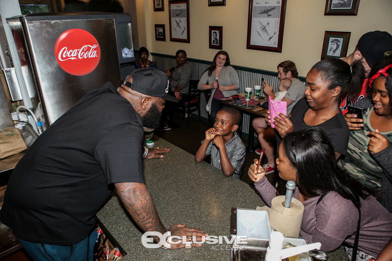 Rick Ross stops by his wingstop in Newnan