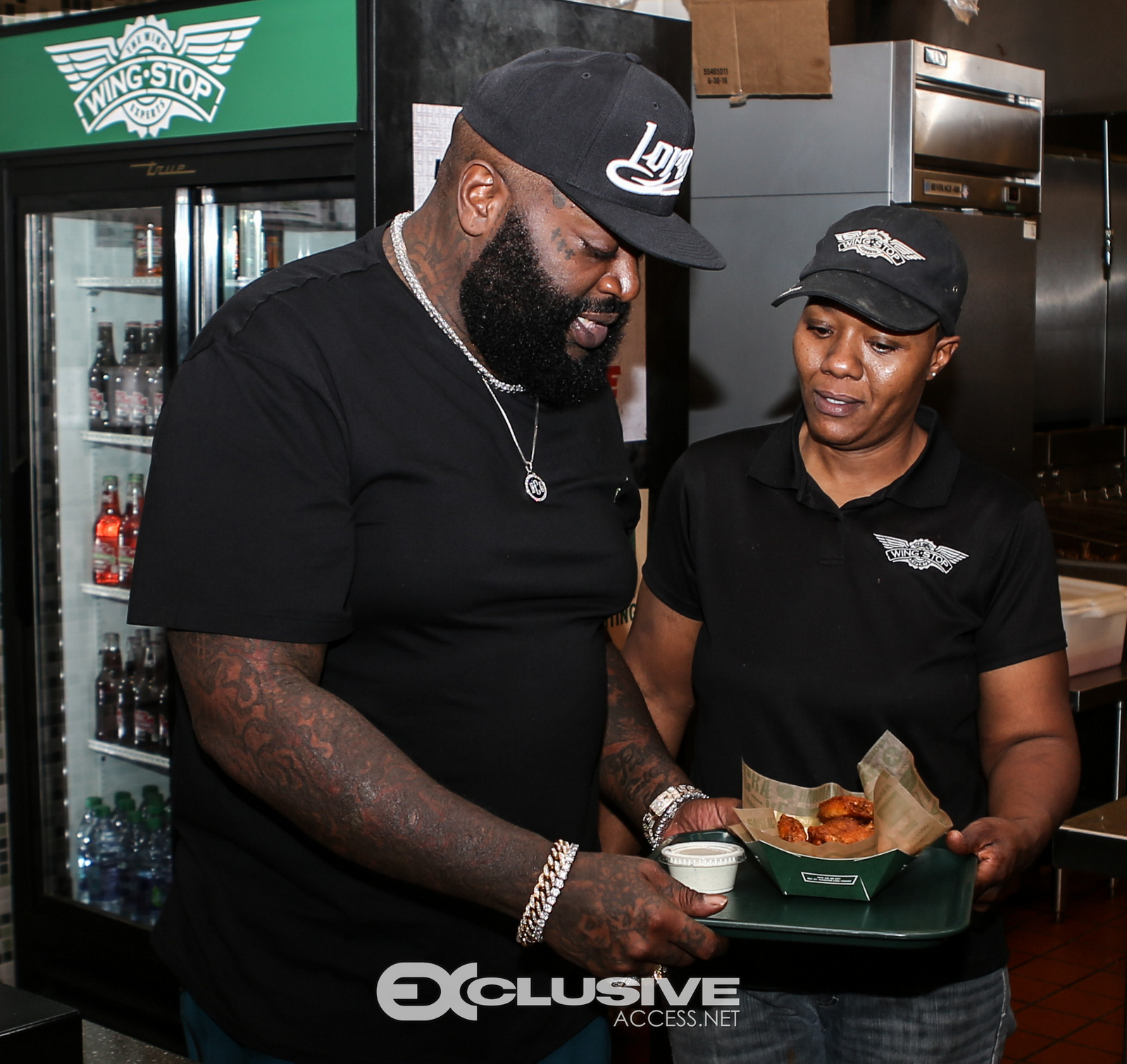 Rick Ross stops by his wingstop in Newnan