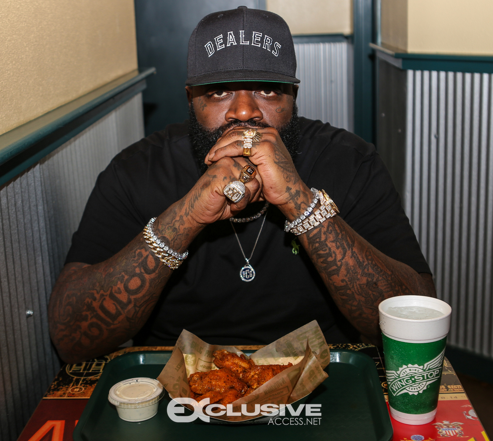 Rick Ross stops by his wingstop in Newnan