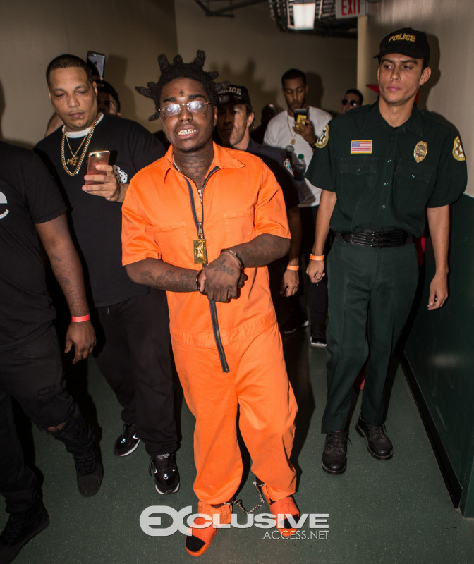 Kodak Black, orange jump suit, concert, police, costume, smile