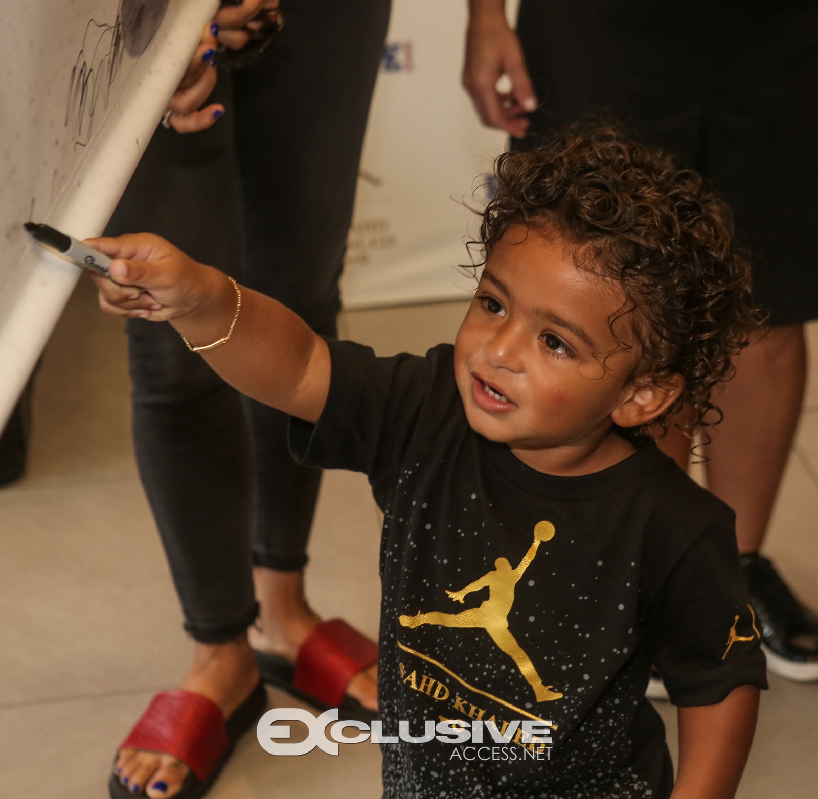 DJ & Asahad Khaled #FanLove at KIds Footlocker photos by Thaddaeus McAdams - ExclusiveAccess