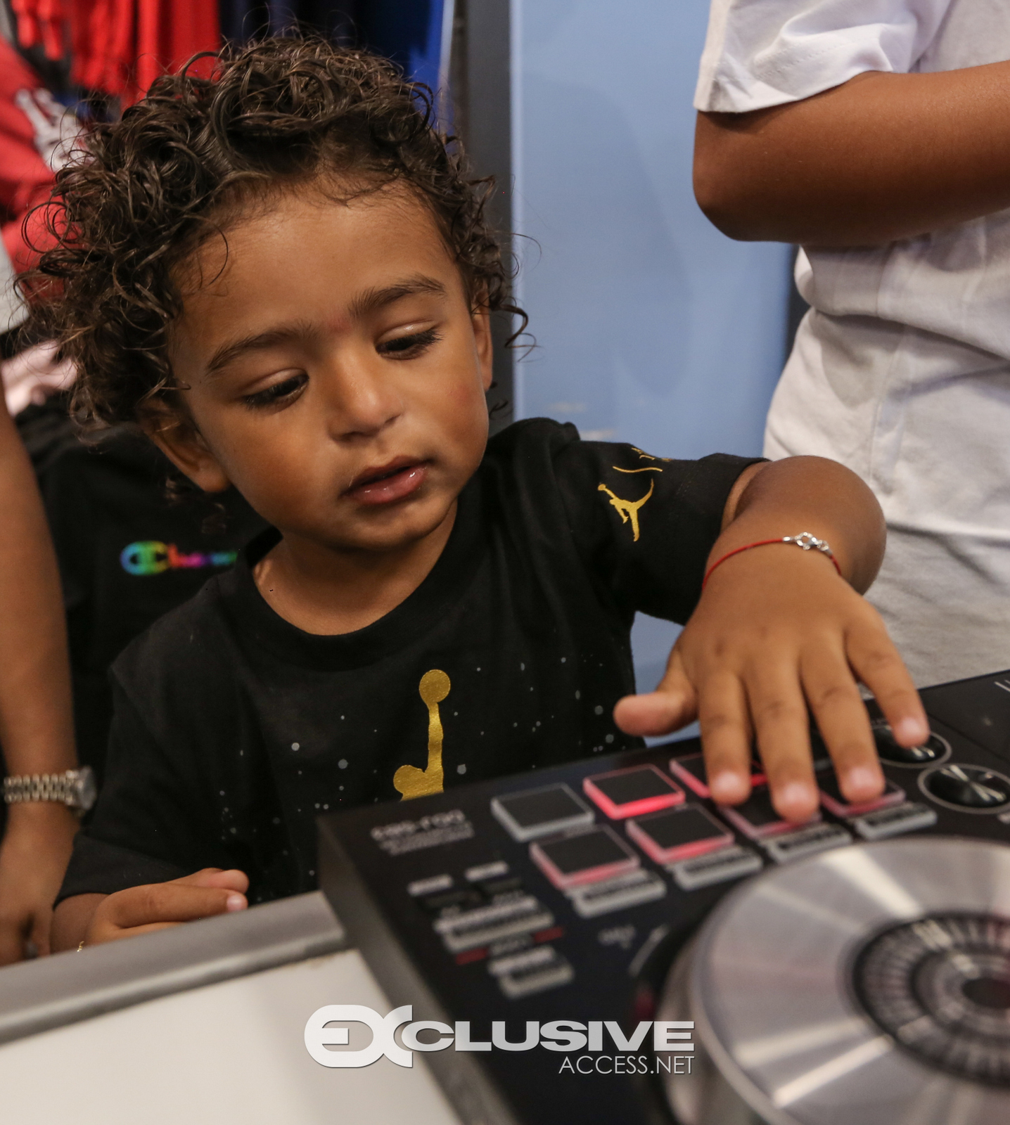 DJ & Asahad Khaled #FanLove at KIds Footlocker photos by Thaddaeus McAdams - ExclusiveAccess