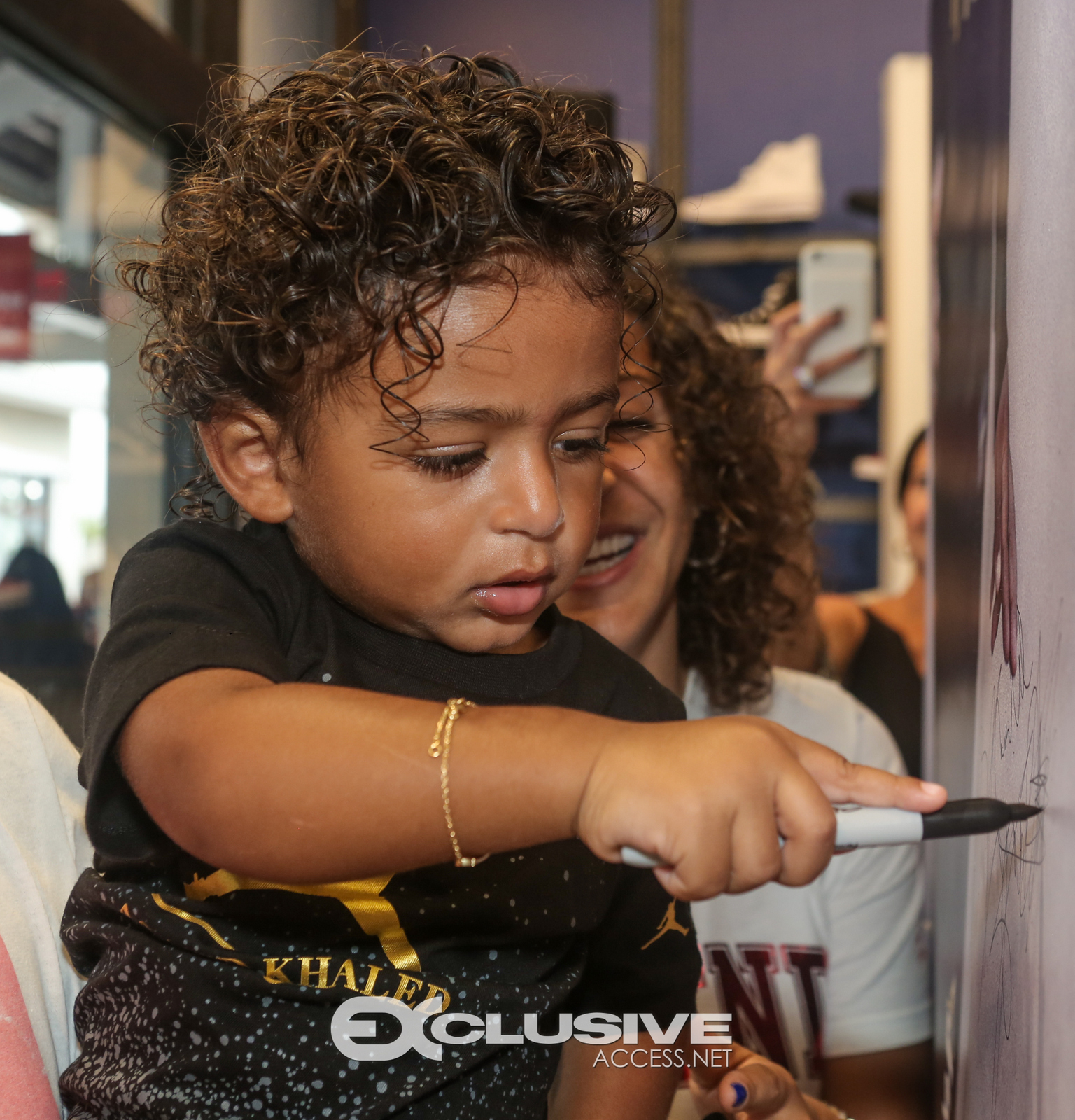 DJ & Asahad Khaled #FanLove at KIds Footlocker photos by Thaddaeus McAdams - ExclusiveAccess